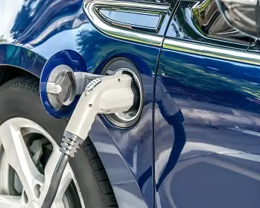 An electric vehicle being charged.